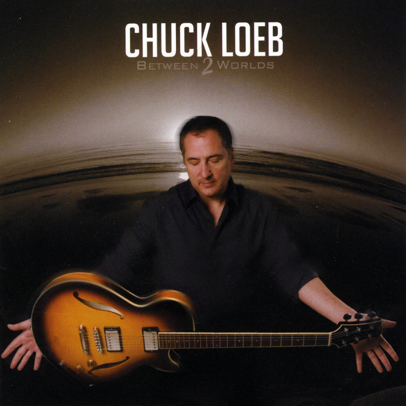 Chuck Loeb - Between Two Worlds | iHeart