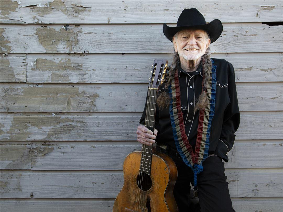 willie nelson playing guitar